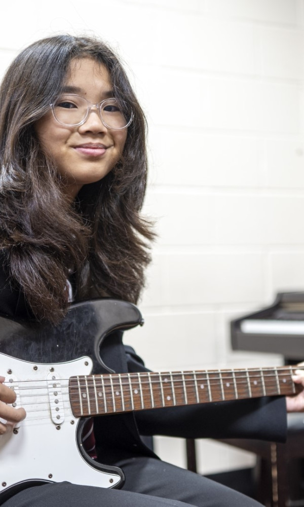 Girl Playing guitar